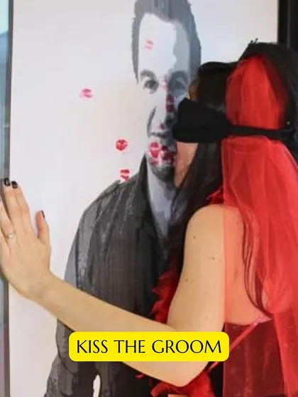 A classic bachelorette game: "Kiss the Groom." A blindfolded bridesmaid tries to plant a kiss on a poster of the groom. It's a simple game that guarantees a lot of laughter.