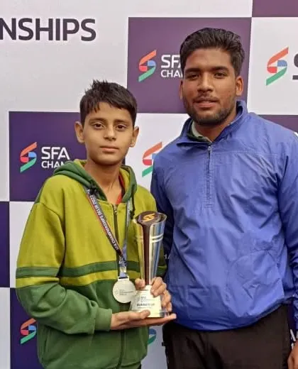Another picture with a student, my 'Guru ji' moment. Guiding these young athletes on their journey is my greatest reward.