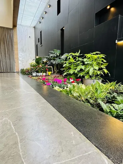 This perspective shows how the long, narrow plant bed fits perfectly into the architecture of the hallway, creating a natural pathway and a beautiful view.