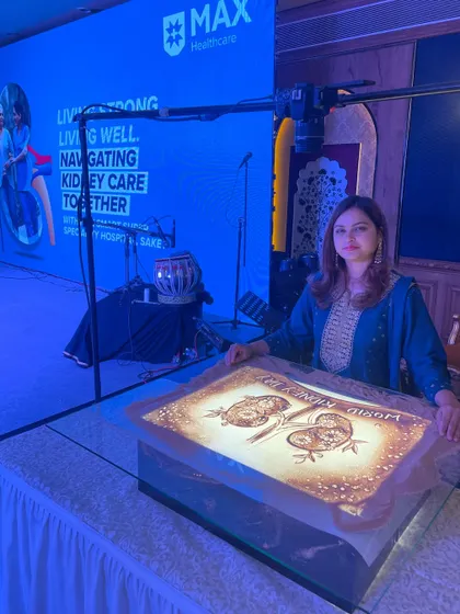 Posing with my artwork after the Max Healthcare event. The piece was designed to raise awareness for kidney care in an artistic and memorable way.