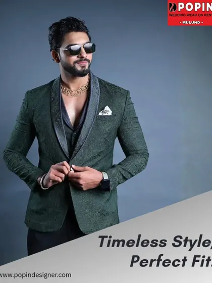 A full look at the textured green designer suit, buttoned up to show its perfect fit. The pocket square adds a final touch of class to this elegant ensemble.