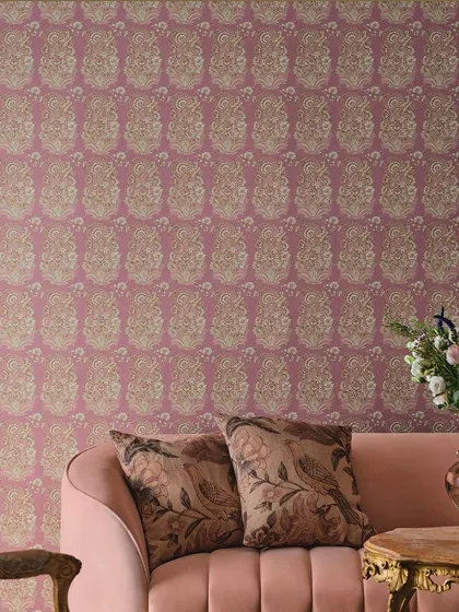 This Jazz Age-inspired wallpaper features a repeating paisley-like pattern in pink and gold, adding a touch of vintage glamour and opulence to the room.