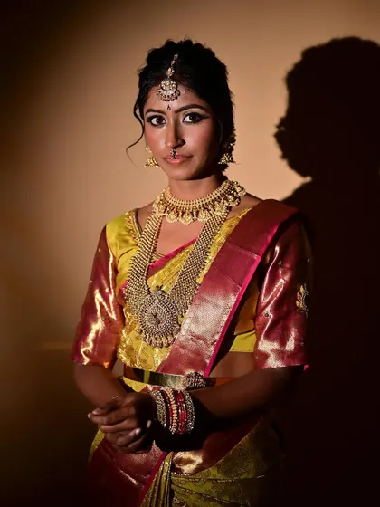 A classic portrait of a South Indian bride. I focused on creating a smooth, even base and defining her eyes to make them stand out, completing the look with traditional jewelry and a neat bun.