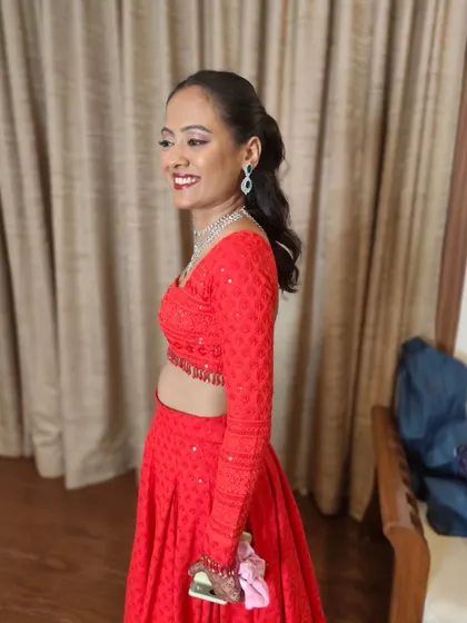 A candid shot of the bride, smiling and looking effortlessly beautiful. The sleek hair keeps the look clean and focuses attention on her face.
