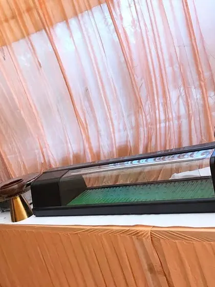 A unique serving station designed to look like a small aquarium, adding a creative and unexpected element to the buffet table.