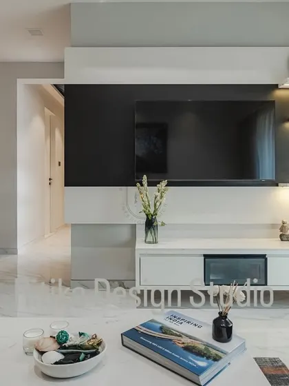 A closer look at the entertainment wall, highlighting the clean lines of the floating console and the ambient light from the display shelves. This setup is designed to be the focal point of the room without overwhelming the space.