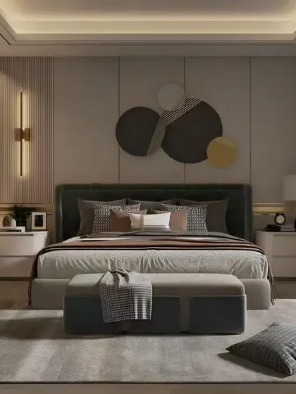 This bedroom design features a large piece of abstract art as the focal point above the bed. The room is furnished with clean lines, a neutral color palette, and a glass-paneled wardrobe.
