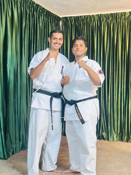 Proud to stand with my student, a new black belt, at our training camp. His hard work and spirit are an inspiration.