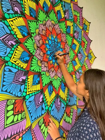 A vibrant, multi colored mandala mural that I call "Color Burst." This 6x6 foot piece was so much fun to create.