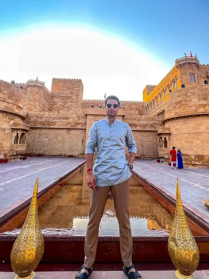 Standing in the majestic courtyard of Suryagarh, Jaisalmer. Traveling for work allows me to experience incredible places like this.