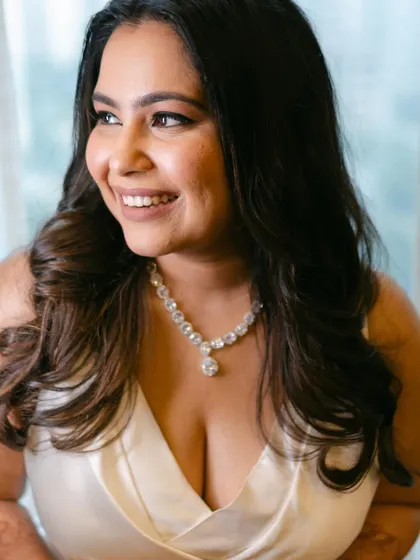 A close-up portrait showing the flawless skin and soft, glowing makeup. This look is all about enhancing her natural beauty.