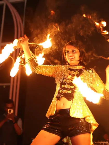 Another look at the Macaw by Stories fire show, this time with fire fans. The golden jacket and the bright flames created a dazzling spectacle.