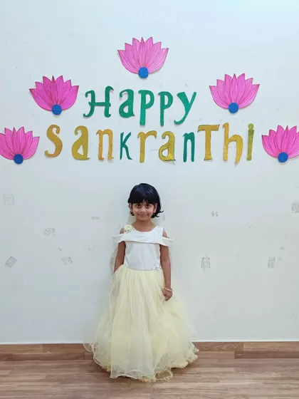 A duplicate of a previous image, showing a student dressed for the Makar Sankranti celebration.