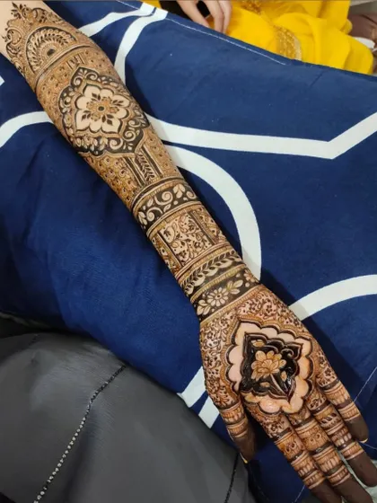 A single-arm view of a beautiful bridal design, showing the intricate patterns and motifs.