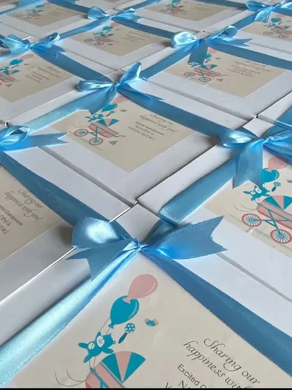 Announcing a new arrival is a precious moment. I had the joy of creating these beautiful baby announcement hampers, complete with personalized cards and delicate blue ribbons to share the happy news with family and friends.