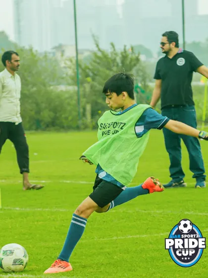 A player in a training bib prepares to make a pass, highlighting a moment from our pre-match drills and warmups.