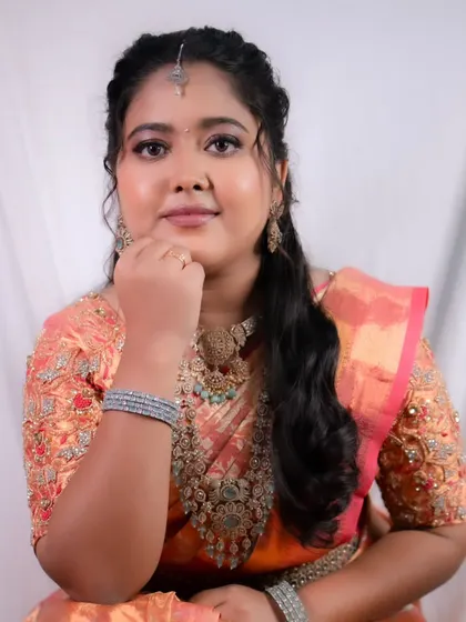 Effortless elegance and timeless grace. A beautiful reception look with a pink and gold saree and soft, glowing makeup.