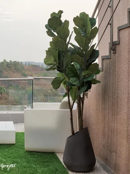 The view from the "Agra Fort" bedroom terrace, looking out over the spiritual valley. We used modern, minimalist furniture to keep the focus on the serene landscape.