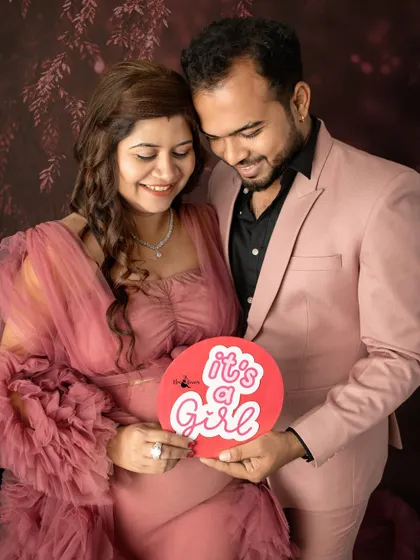 "It's a Girl!" This photo captures the happy announcement with a bright, cheerful prop, celebrating the little princess on her way.