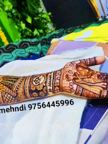A side view of a full bridal arm design. This shows how the pattern continues all the way around, with names and symbols hidden within the intricate artwork.