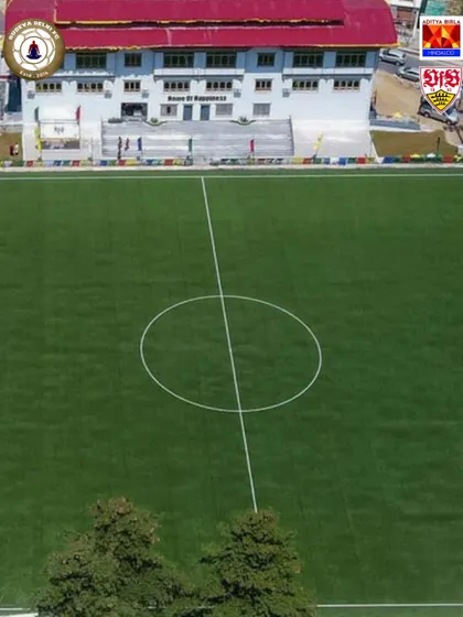 An aerial view of the pristine football pitch at the Bhutan Football Federation. We partner with organizations that share our commitment to quality infrastructure.