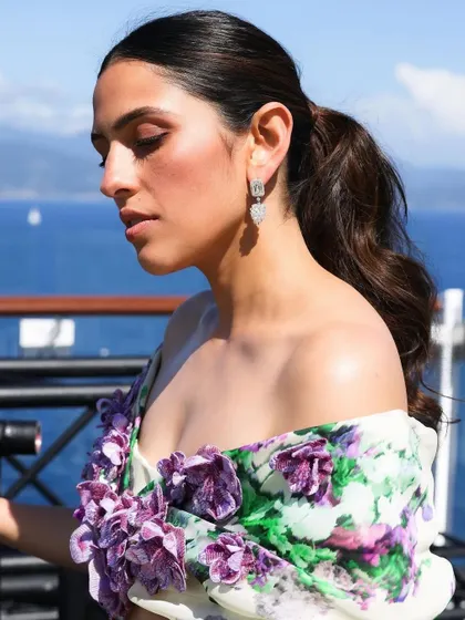 A close-up on the 3D floral appliqué and the beautiful hair and makeup that completed this romantic Italian look.