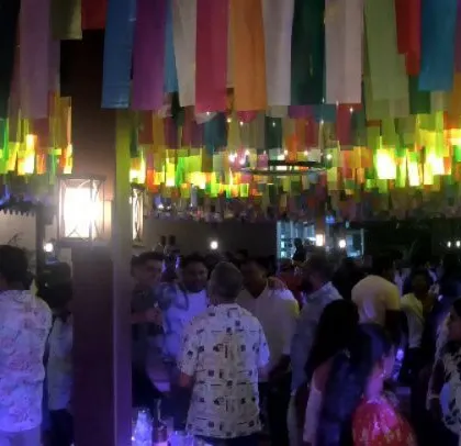 The crowd is dancing and having a great time.