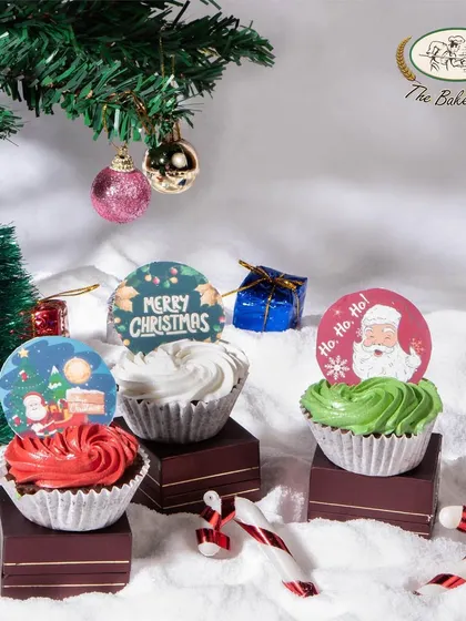 Our Christmas cupcakes are perfect for parties and gifting. Each one is topped with festive frosting and a cute holiday-themed topper.