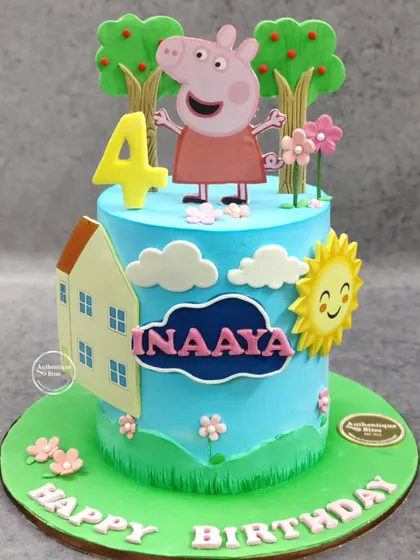 A cheerful Peppa Pig cake for a 4th birthday. This pineapple-flavored cake features Peppa in her happy world with her house, trees, and a smiling sun.