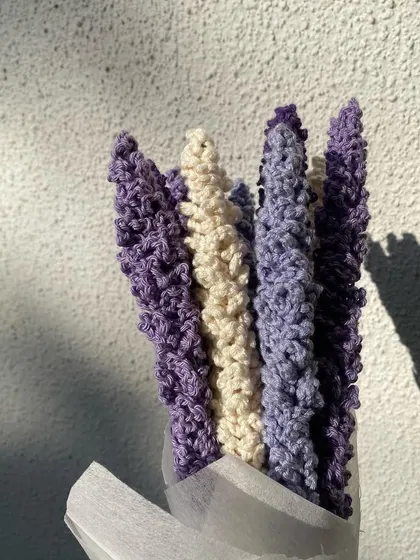 A close-up shot of our crochet lavender bouquet, showcasing the detailed texture and beautiful color variations that make these flowers look so realistic.