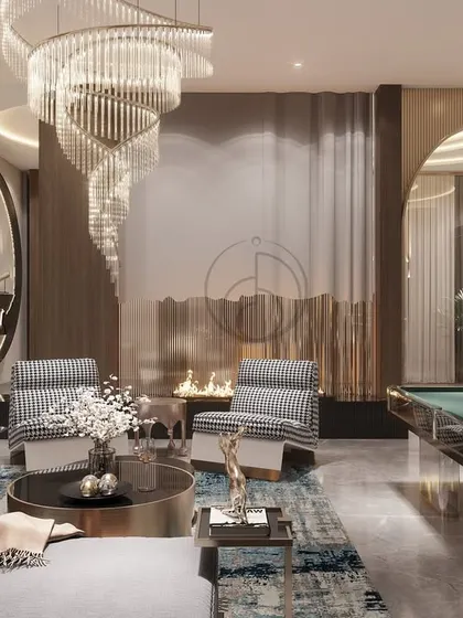 This view shows the full entertainment potential of the space, with a pool table seamlessly integrated into the lounge area. The design proves that a room can be both elegant and playful, with arched doorways adding an architectural flourish.
