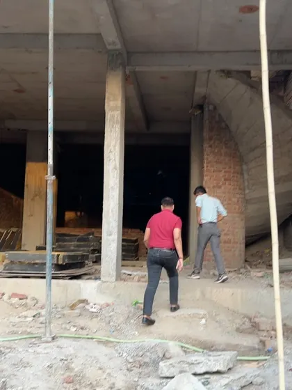 Entering the ground floor of a building under construction. I personally walk through every level to monitor progress and quality.