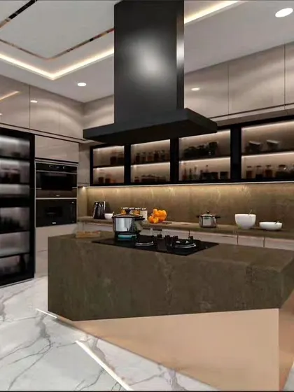 The kitchen is the heart of the home, and we design it to be both beautiful and highly functional. This modern kitchen features an island with an integrated cooktop, sleek cabinetry with under-cabinet lighting, and state-of-the-art appliances, creating a perfect environment for culinary creativity.