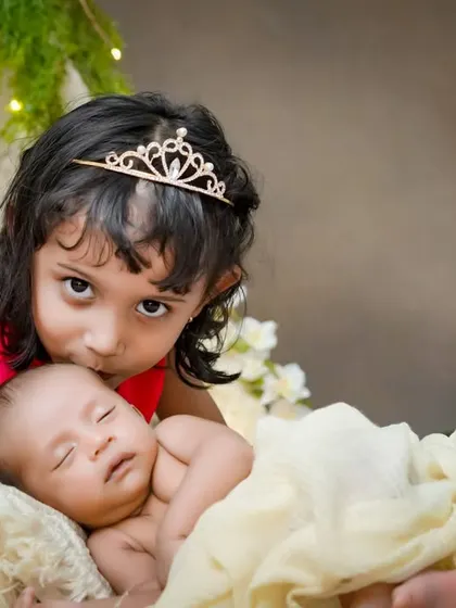 A princess and her new, tiny subject. I love creating these storybook moments, where a big sister's love and protection for her new sibling shines through.