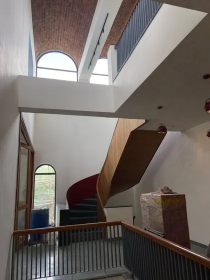 The Brick Vault House showcases my work in adaptive reuse. A feature spiral staircase ascends through a multi-height volume, crowned by a massive, exposed brick vault that defines the character of the entire residence.