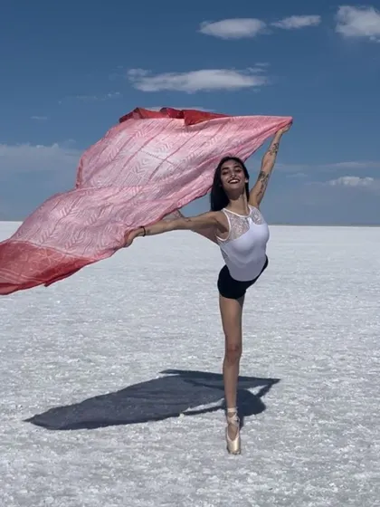 Our student Maya Nambisan at the Bonneville Salt Flats in Utah during the ArtEmotion Adult Ballet Summer Intensive. The landscape provides a stunning backdrop for her graceful pose.