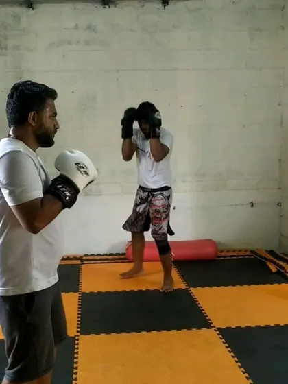 A student practicing his boxing stance and guard during a weekend kickboxing class. We emphasize solid fundamentals from day one.