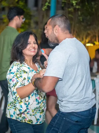 A fun and playful interaction on the dance floor. The smiles are contagious.