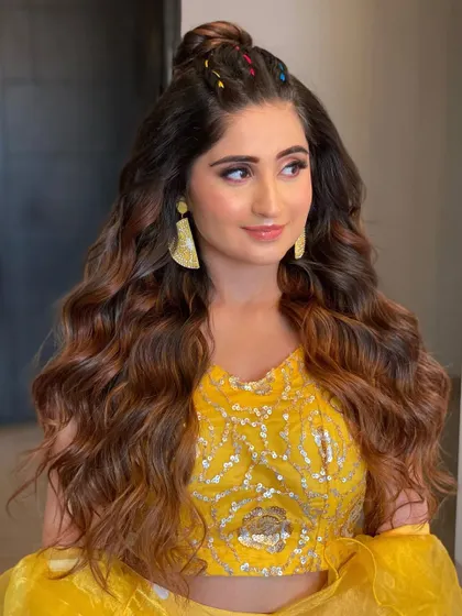Another look at the braided half-tie taught in my course. The colorful threads add a playful touch to the voluminous waves created with my extensions.