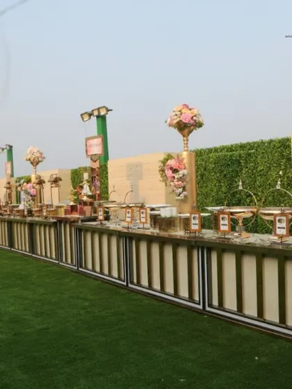 A long shot of our extensive buffet line at an outdoor event. This showcases our capacity to handle large gatherings without compromising on elegance or service quality.