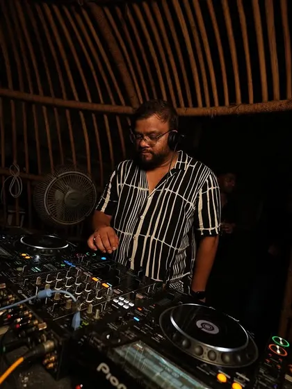 At the console in a rustic, bamboo-lined DJ booth in Goa. The setting was as unique as the music.