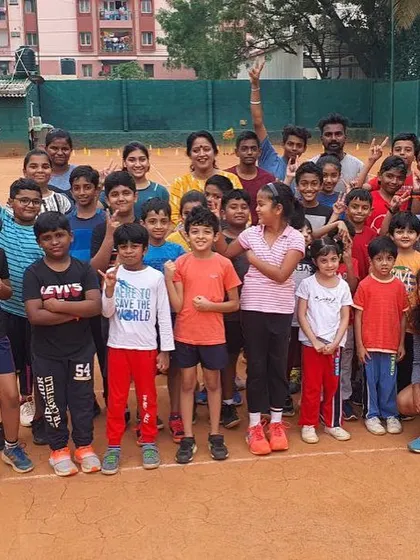 This is my team, my family. This picture captures the amazing energy of a group session at the academy. We welcome players of all ages, creating a supportive and enthusiastic environment for both kids and adults to learn and grow in tennis.