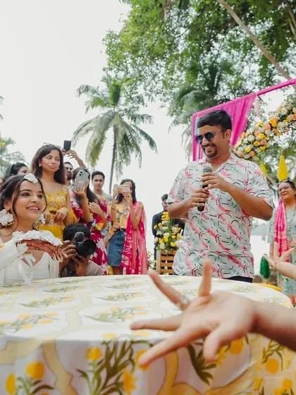 It's not just a ceremony, it's a celebration! Here, the bride and groom's families engage in fun games during the Haldi, adding a layer of playful competition to the day.