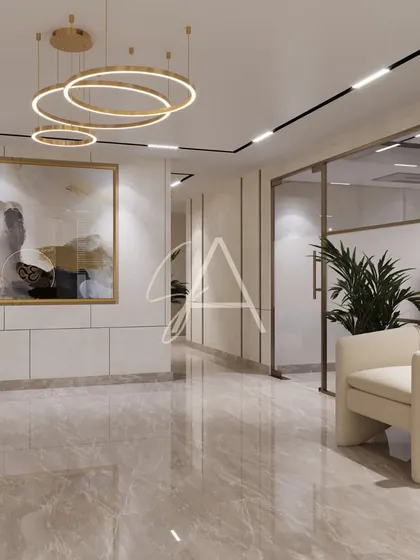 The elegant hallway in our Defence Colony office project. Polished marble floors reflect the light from modern ring chandeliers, creating a bright and impressive corridor that connects different parts of the office.