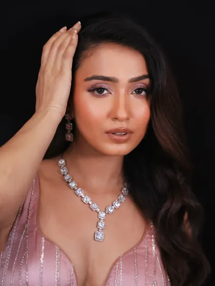This close-up shows the flawless skin and soft eye makeup, perfect for a high-end event.