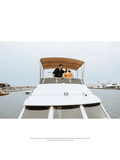 A wide shot of the couple standing together on the yacht, emphasizing the sense of adventure and the beginning of their journey together.