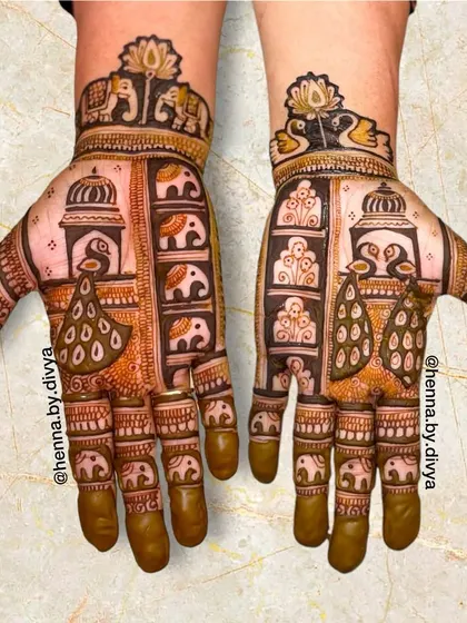 A design that heavily features peacocks and elephants arranged in vertical panels. This style is inspired by traditional Indian art and architecture.