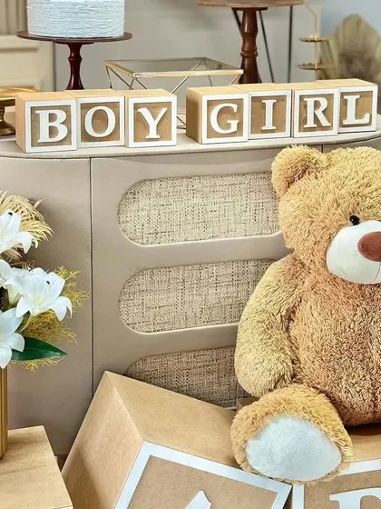 "Follow the trend, go for teddy." This shot shows a larger teddy bear prop and "Boy Girl" blocks, perfect for a gender reveal party or a neutral baby shower theme.
