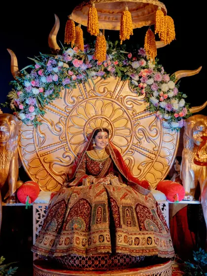 A bride deserves to feel like a queen. For this Jaipur palace wedding, we created a grand, throne-like seating for her entrance, making it a truly royal affair.