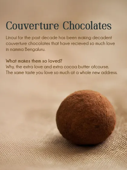 This image explains what makes our couverture chocolates so loved in namma Bengaluru: the extra love and extra cocoa butter. Pictured is a single, perfect cocoa-dusted truffle.